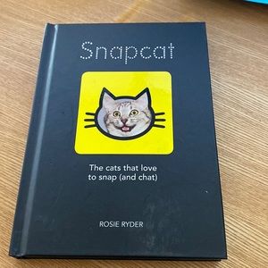 Snapchat a hard covered book the cats that love to snap really cute, full color